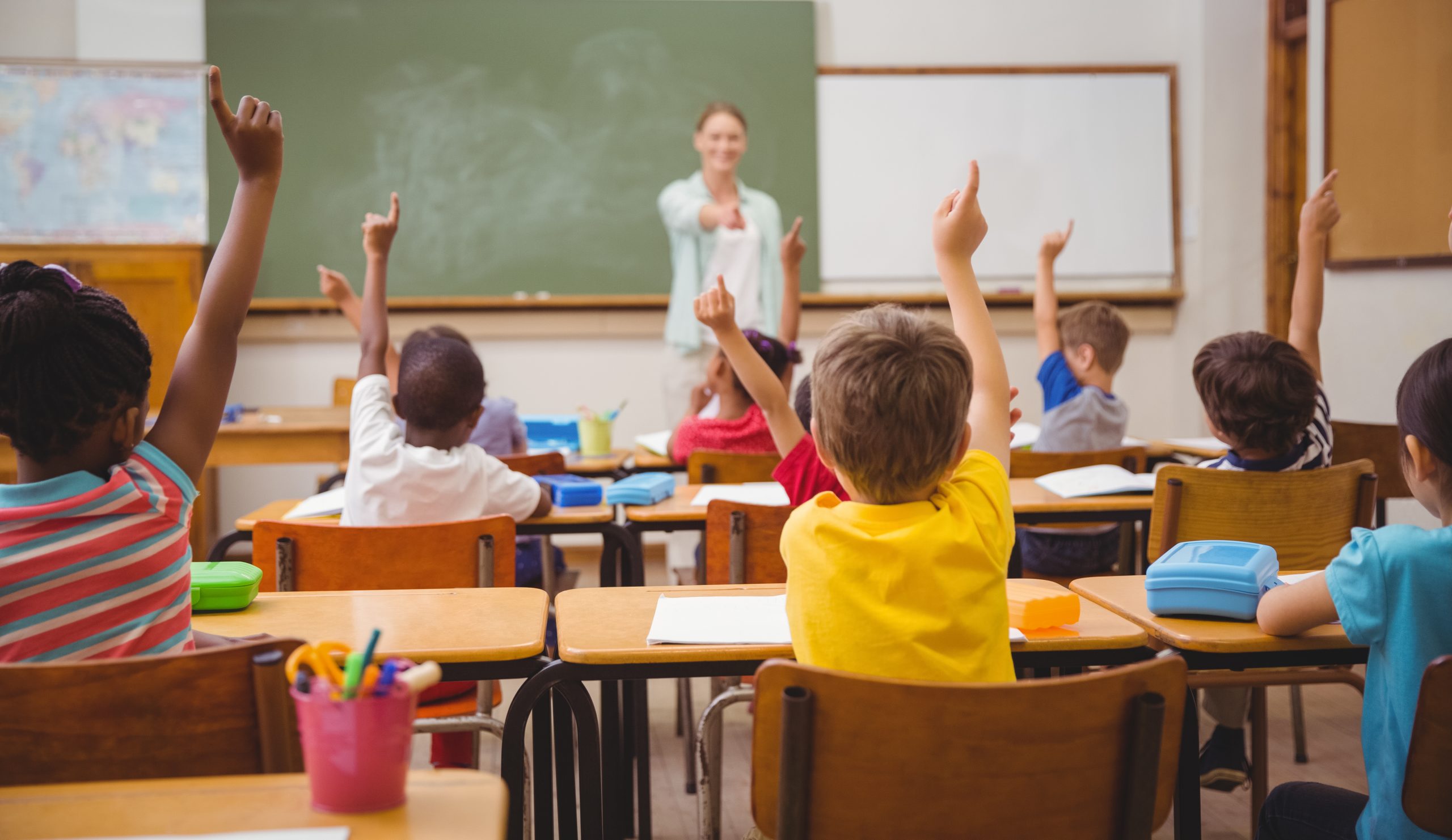 Pupils,Raising,Their,Hands,During,Class,At,The,Elementary,School